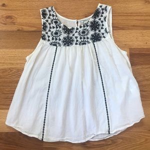 Cream blouse with blue embroidery